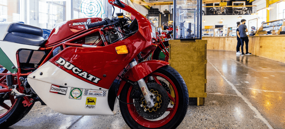 customers shopping pre-roll with motorcycle in foreground